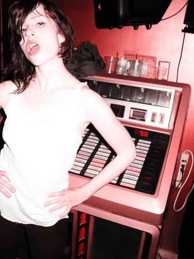 Girl next to jukebox at Transistor
